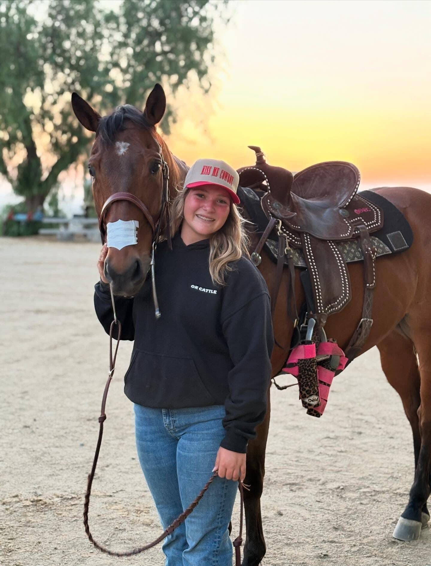 Remy Slobodian with a tacked horse at golden hour